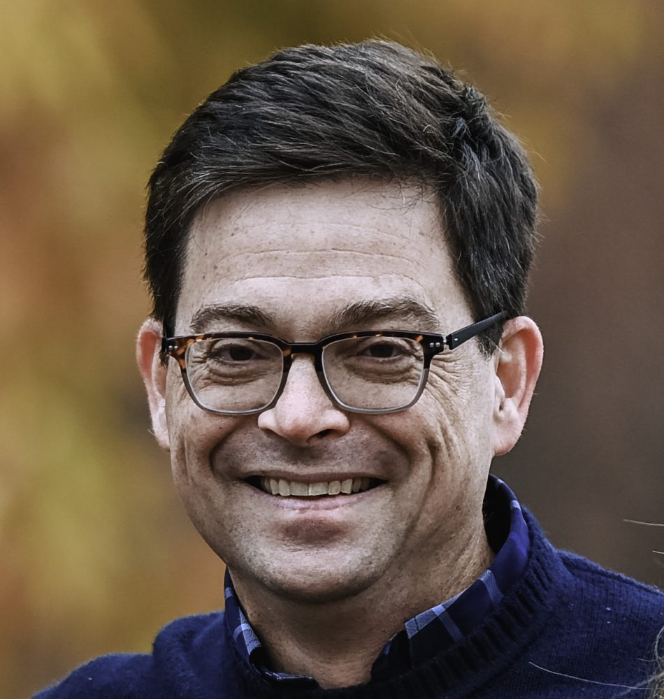 Profile picture of Michael Sisolak, a white male with dark hair and glasses, to accompany an interview post.