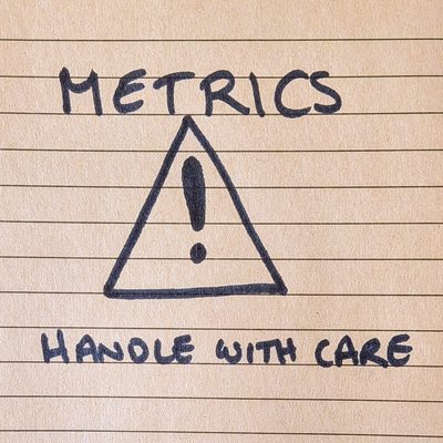 A warning triangle. The label reads 'metrics: handle with care'.